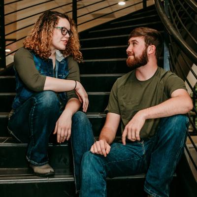 Two students sitting on stairs chatting